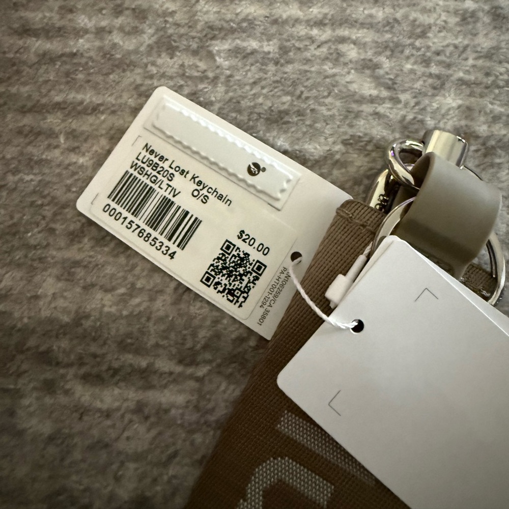 Lululemon Neverlost Keychain in Warm Ash Gray - Picture 2 of 2